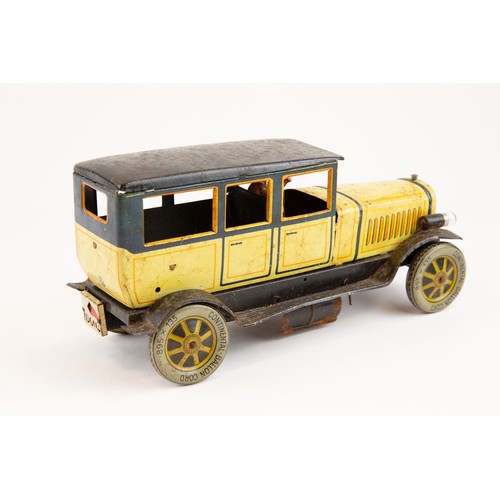 260 - An early 1900's German Distler tinplate clockwork Limousine (603). In cream and dark blue with black... 