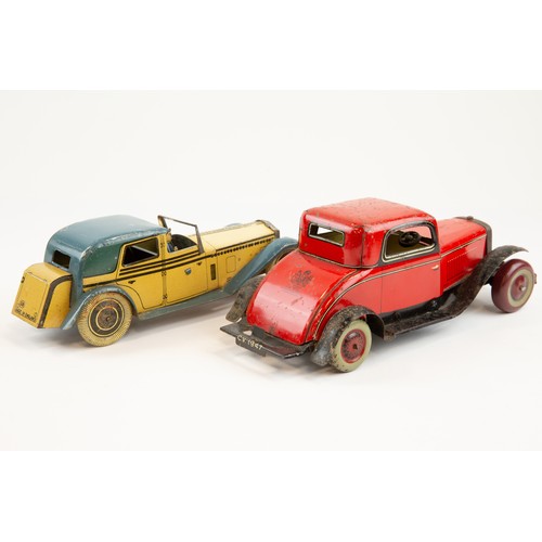 261 - 2 tinplate cars. A Wells Brimtoy Rolls Royce Coupe de Ville. In cream and blue livery with Chauffeur... 