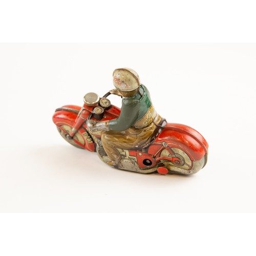 262 - Tinplate Schuco clockwork powered Motorcycle. Length 13cm, Schuco Curvo 1000. In red with civilian r... 