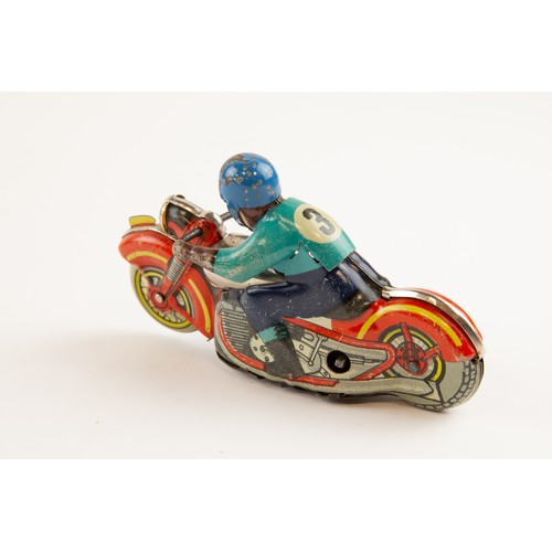 265 - German WV Tinplate clockwork powered Racing Motorcycle. Length 13cm, racing number 3. In red with ye... 