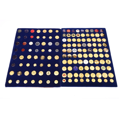 105 - Two button manufacturers blue velvet covered display boards, one with 90 mostly gilt, some enamelled... 