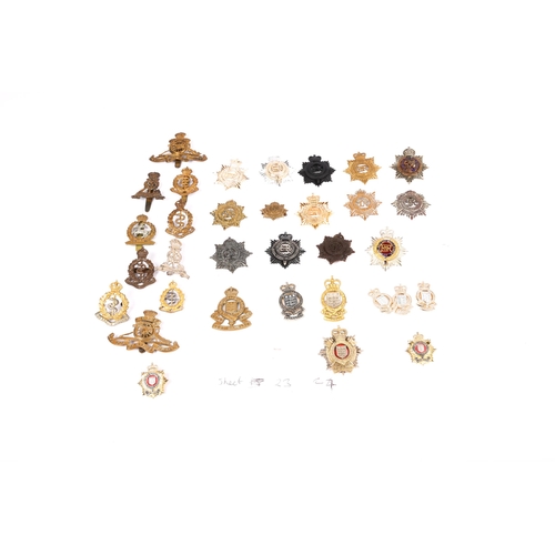 119 - 17 cap badges of the R.A.S.C. and R.A.O.C., mounted on a card, 8 other Corps cap badges, including R... 