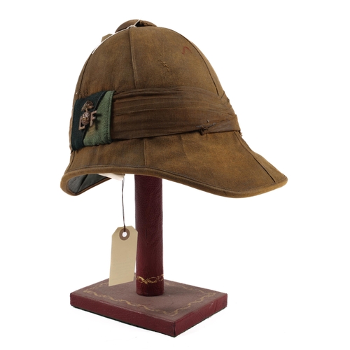 A Boer War type Foreign service helmet, khaki coloured cloth with ...