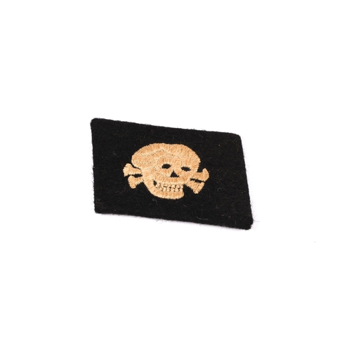 54 - A Third Reich SS Man's worsted embroidered skull collar patch. £70-100