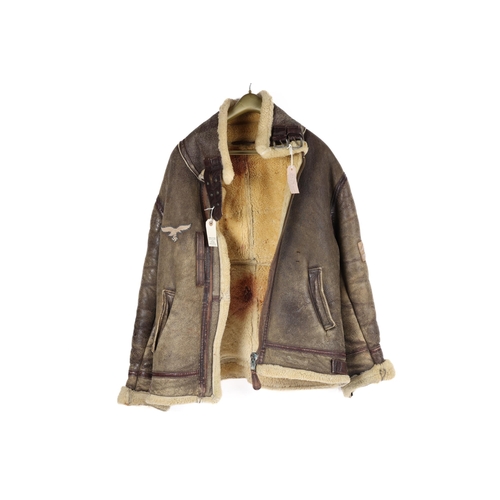 58 - A Third Reich Luftwaffe flying jacket, sheepskin lined, similar to an Irving jacket, with eagle etc ... 