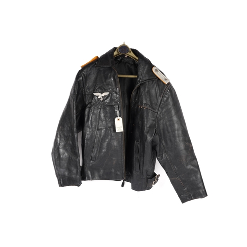 59 - A Third Reich Luftwaffe officer's black leather flying jacket, with silver alloy embroidered eagle b... 