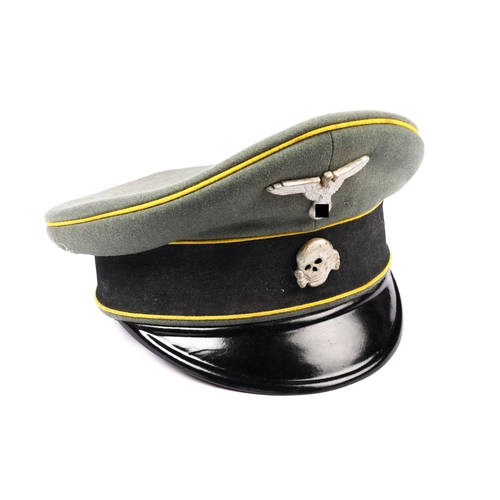 65 - A Third Reich SS cavalry NCO's peaked SD cap, field grey with yellow piping, alloy insignia. GC £200... 