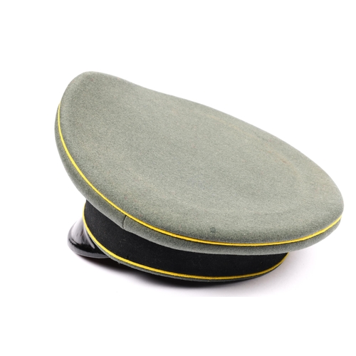 65 - A Third Reich SS cavalry NCO's peaked SD cap, field grey with yellow piping, alloy insignia. GC £200... 