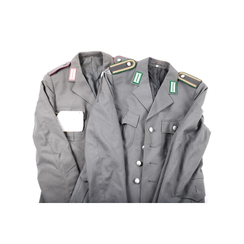 61 - 6 post WWII German army grey SD jackets, a grey greatcoat, a Royal Naval jacket and 3 other items. M... 