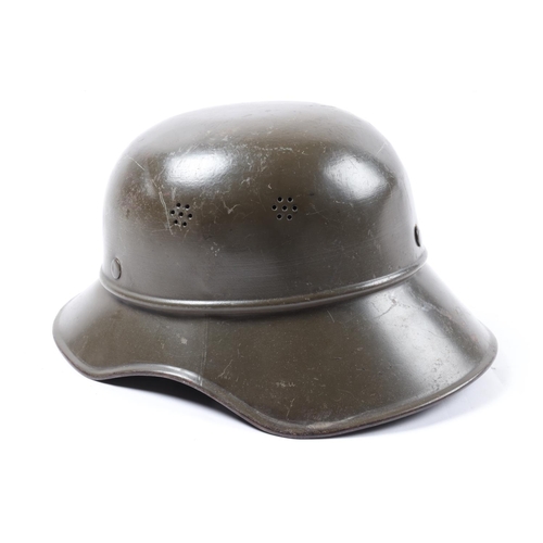 74 - A German WWII Luftschutz helmet, decal to front and red cross badge painted to side, chinstrap detac... 