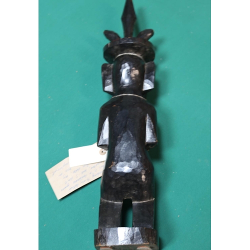 409 - A very unusual and interesting hand carved figure in possibly ebony of what is believed to be a Japa... 