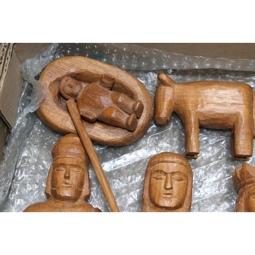 411 - A wooden hand carved nativity set from Paraguay comprising of Jesus in a crib, Mary, Joseph, A sheph... 