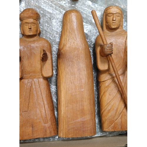 411 - A wooden hand carved nativity set from Paraguay comprising of Jesus in a crib, Mary, Joseph, A sheph... 