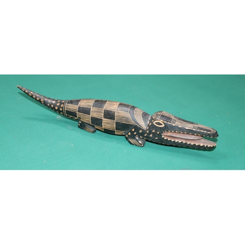 419 - A tribal carved model of an alligator possibly from Rwanda dating from the 1960s. 43 cm in length, h... 