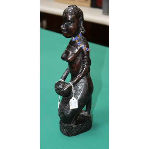 421 - Hand carved figure of a tribal lady with baby on her back, Kneeling down holding a container, Damage... 