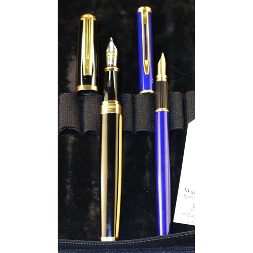 438 - 2 Waterman Fountain Pens. One black with gold trim. The other in dark blue also with gold trim. VGC.... 