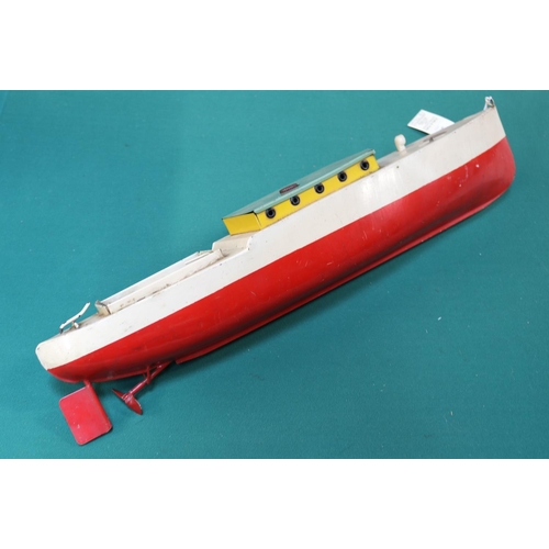 508 - A seldom seen Sutcliffe tinplate clockwork powered motor launch. 54cm, painted in cream with red hul... 