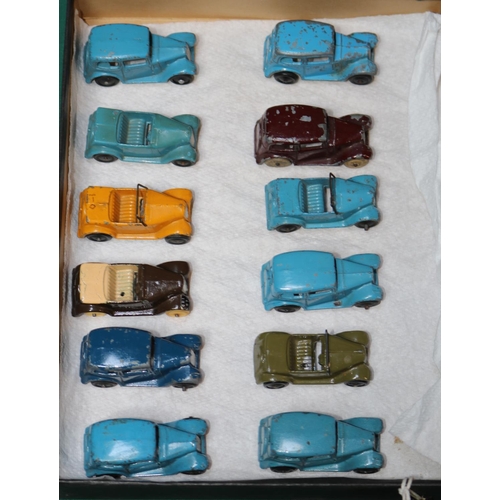 582 - 12 Dinky Toys 'Dinky Series' (35a/35d). Austin 7 Saloons and Open Tourers. In blue, dark blue, maroo... 