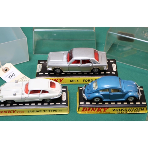 600 - 3 Dinky Toys. Jaguar E Type (131) in white with red interior. Volkswagen De Luxe Saloon (129) in met... 