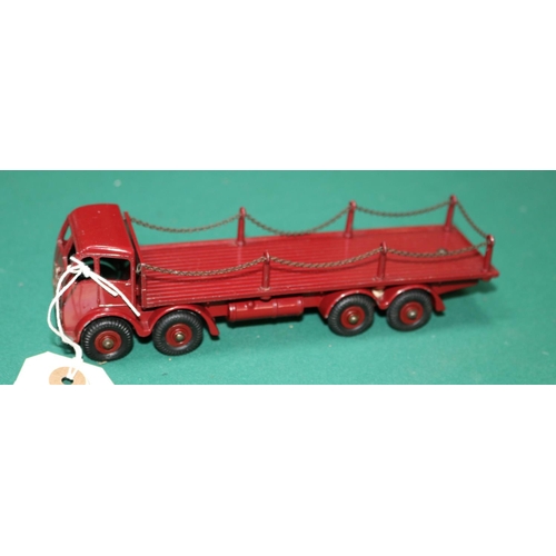 611 - A Dinky Toys Foden Flatbed with Chains (505). In maroon with maroon wheels. VGC, minor chips only. £... 