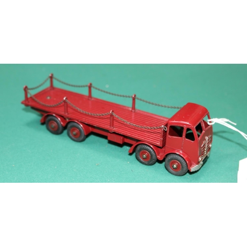 611 - A Dinky Toys Foden Flatbed with Chains (505). In maroon with maroon wheels. VGC, minor chips only. £... 