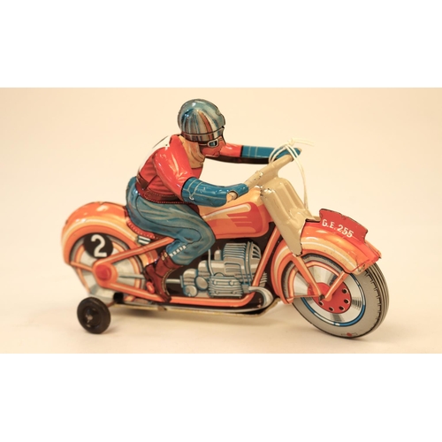 635 - A Technofix GE255 tinplate clockwork racing motorcycle. Brightly coloured in orange with litho detai... 