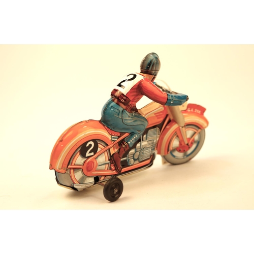 635 - A Technofix GE255 tinplate clockwork racing motorcycle. Brightly coloured in orange with litho detai... 