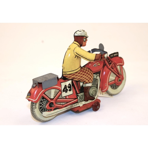 636 - A rare Mettoy tinplate clockwork racing motorcycle TT3149. Bike in red, RN49, Litho detail, rider wi... 