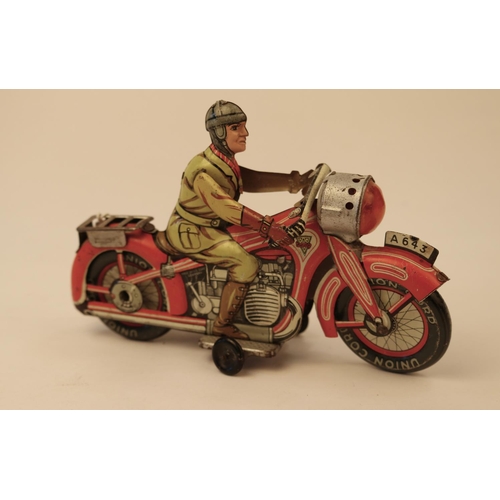 639 - A rare Arnold A643 tinplate clockwork touring motorcycle. In red and white with litho detailing, rid... 