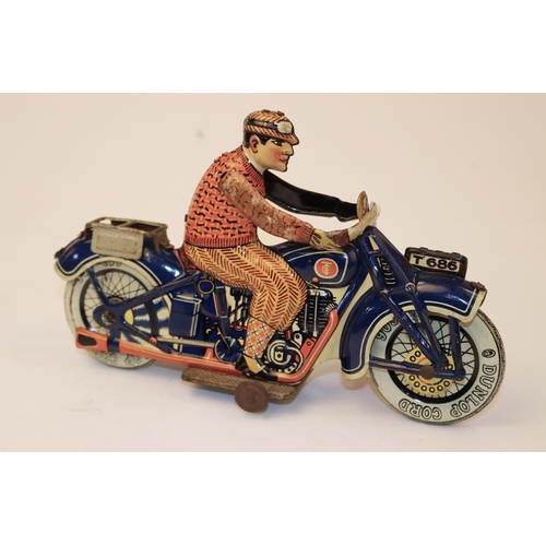 640 - A rare Tipp & Co tinplate clockwork motorcycle T686. Bike in dark blue with Litho detail, with civil... 