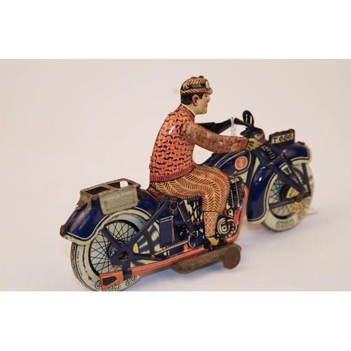 640 - A rare Tipp & Co tinplate clockwork motorcycle T686. Bike in dark blue with Litho detail, with civil... 