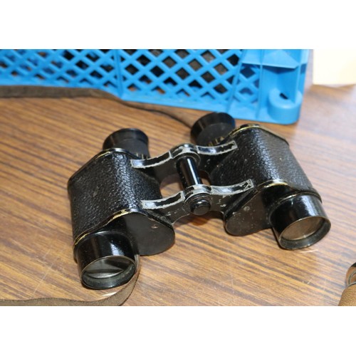 366 - 2 pairs of vintage binoculars, one is of military issue and comes with its original leather case, li... 