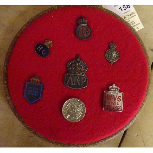 158 - 7 WWII Home Front lapel badges, mounted on a circular hanging frame; 4 other similar lapel badges; a... 