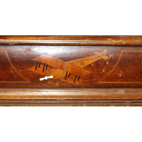 23 - A mantle clock set in a mahogany propeller boss, marked 