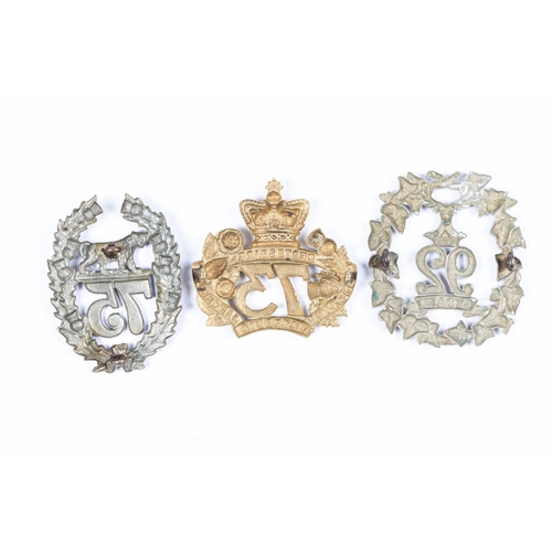 211 - Two pre 1881 brass glengarry badges, of the 73rd (Perthshire), and 75th (Stirlingshire), and a white... 