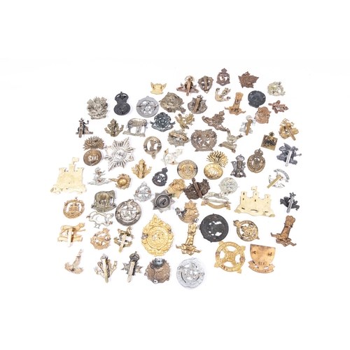 290 - 70 restrike, copy, cast and dubious cap badges, glengarry badges and others. £80-120