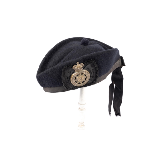 311 - A Victorian OR's glengarry cap of the East Surrey Regiment, blue cloth with brass badge. GC £80-85