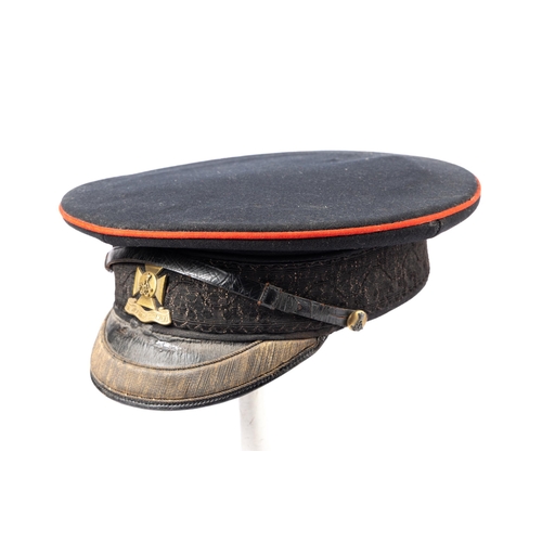 322 - A good Edwardian officer's peaked cap of the Wiltshire Regiment, gilt and silvered badge and side bu... 