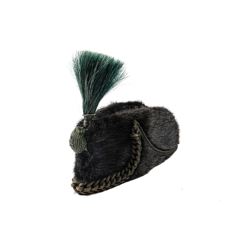 323 - A Royal Irish Rifles OR's sealskin rifle cap, dated 1901, green plume, cords and boss with blackened... 