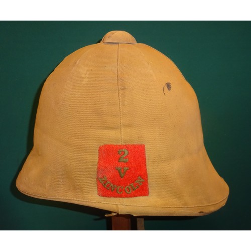 345 - A scarce Victorian Boer War type foreign service helmet, complete with khaki cover bearing patch of ... 