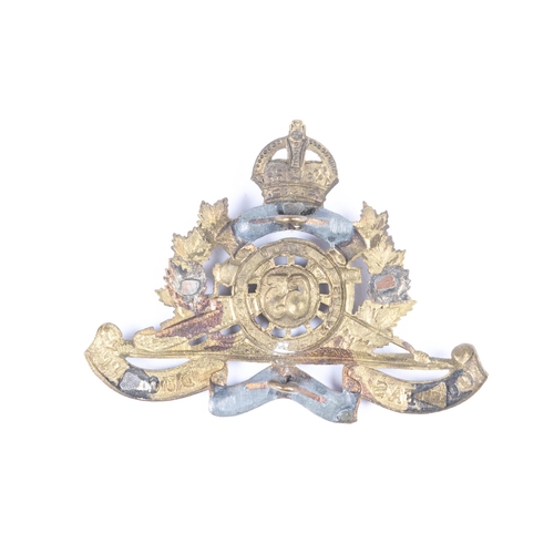 185 - A WWI CEF Artillery cap badge of the 65th Overseas Field Battery, GC (tangs replaced by two soldered... 