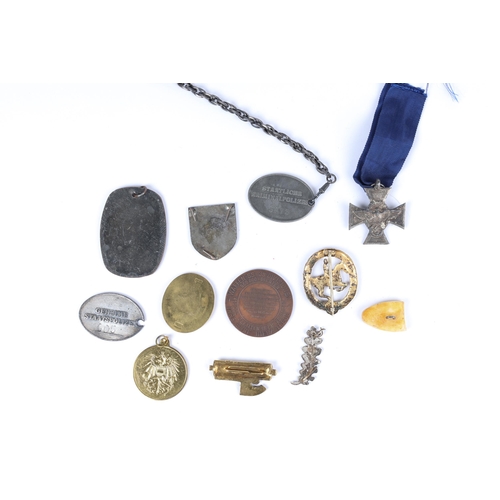 119 - 12 Third Reich awards and ID tags, post war replicas of Gestapo and SS items. GC £40-50