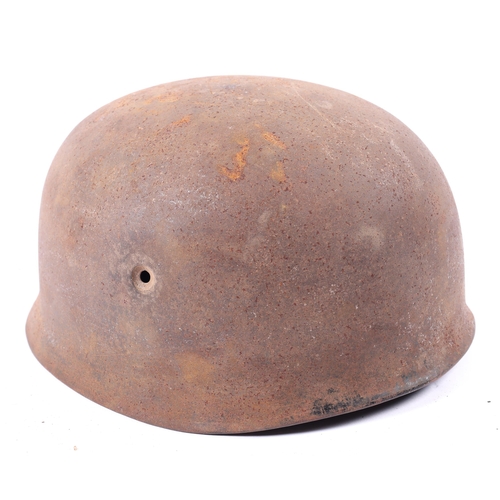 129 - The rusty shell of a WWII German Paratrooper's helmet, maker's code 