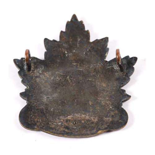 174 - A WWI C.E.F.  cap badge of the Winnipeg Forestry Company (Military District 10), with silver wash on... 