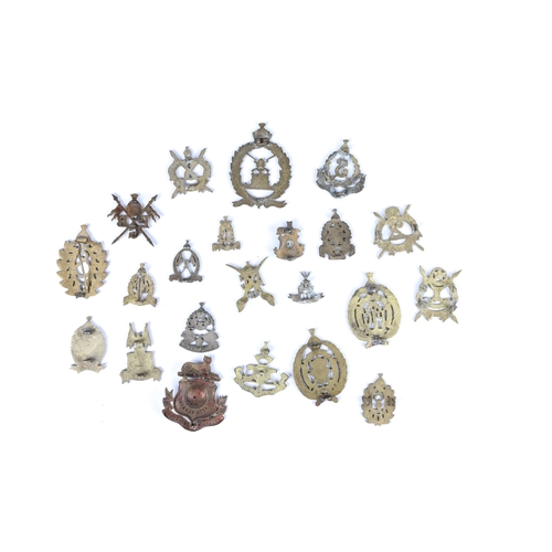 194 - 21 cast brass badges of the Hyderabad State Forces, and a large die struck badge of the 1st Hyderaba... 