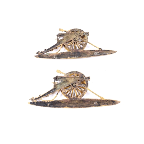 205 - A pair of large gilt brass cannon badges, 6½