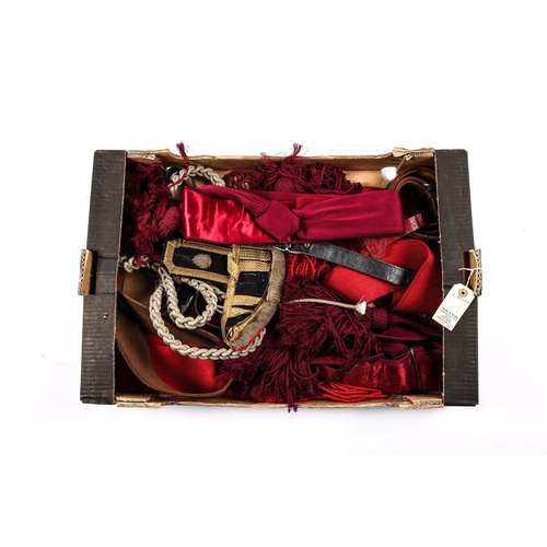 217 - A quantity of military uniform accessories etc, including crimson sashes, stable belts, an Irish Gua... 