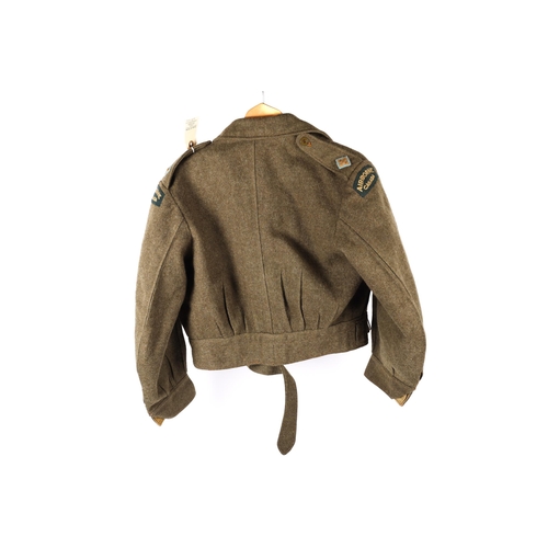 242 - A WWII Canadian khaki battledress blouse, by the Earl Clothing Co, Montreal, 1943 with 2nd Lieutenan... 