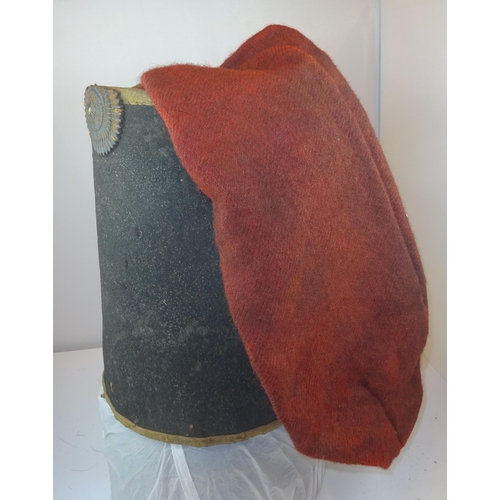 263 - An extremely rare Hussar type black felt busby c 1805, with red bag, black leather cockade, original... 