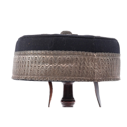 288 - A Victorian officer's pill box hat of the Volunteer Artillery, blue with silver lace GC (the lace ta... 